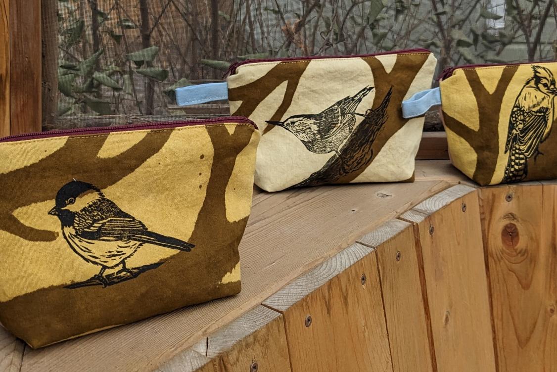 Three pouches with bird prints