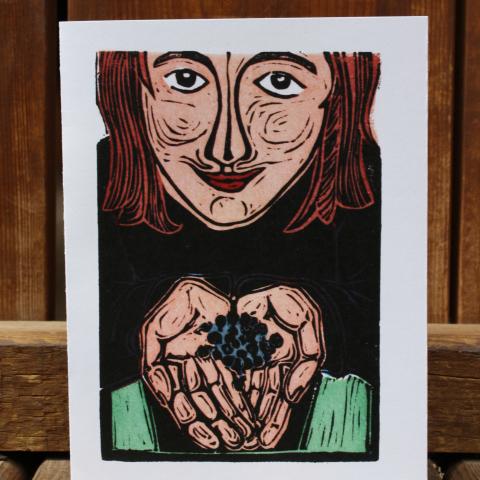 Card showing girl holding blueberries