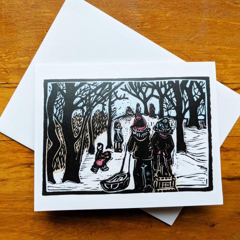 Card showing kids sledding, with envelope