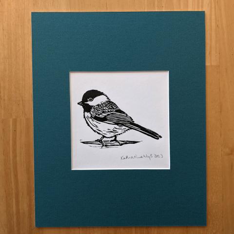 Matted print of a chickadee