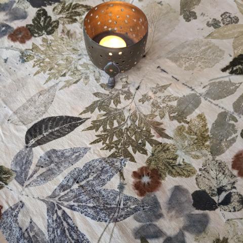 Eco-printed table runner with candle