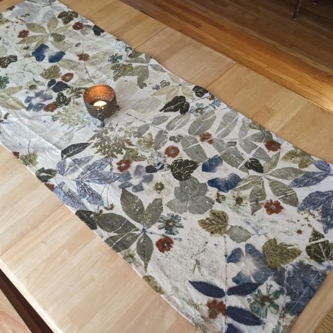 Eco-printed table runner with candle