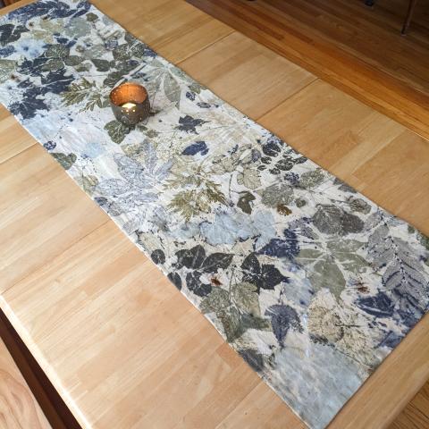 Eco-printed table runner with candle