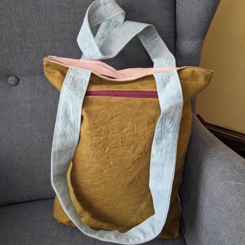 Plant dyed bag with a zipper pocket