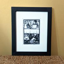 Framed linocut print of two adults visiting at the dinner table, and kids playing cards underneath the table, while a cat steals some chips from a bowl under the table