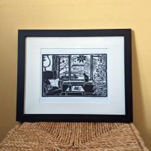 Framed linocut print of  cozy Christmas living room