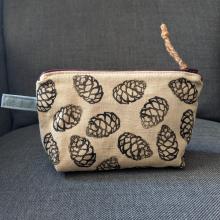 acorn dyed zipper pouch with prints of spruce cones