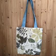 Ecoprinted tote bag hung up on a wall