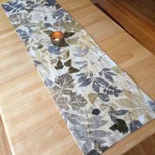 Eco-printed table runner with a candle